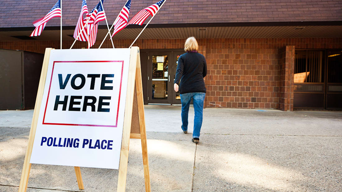 A 'Vote Here' sign at a polling place